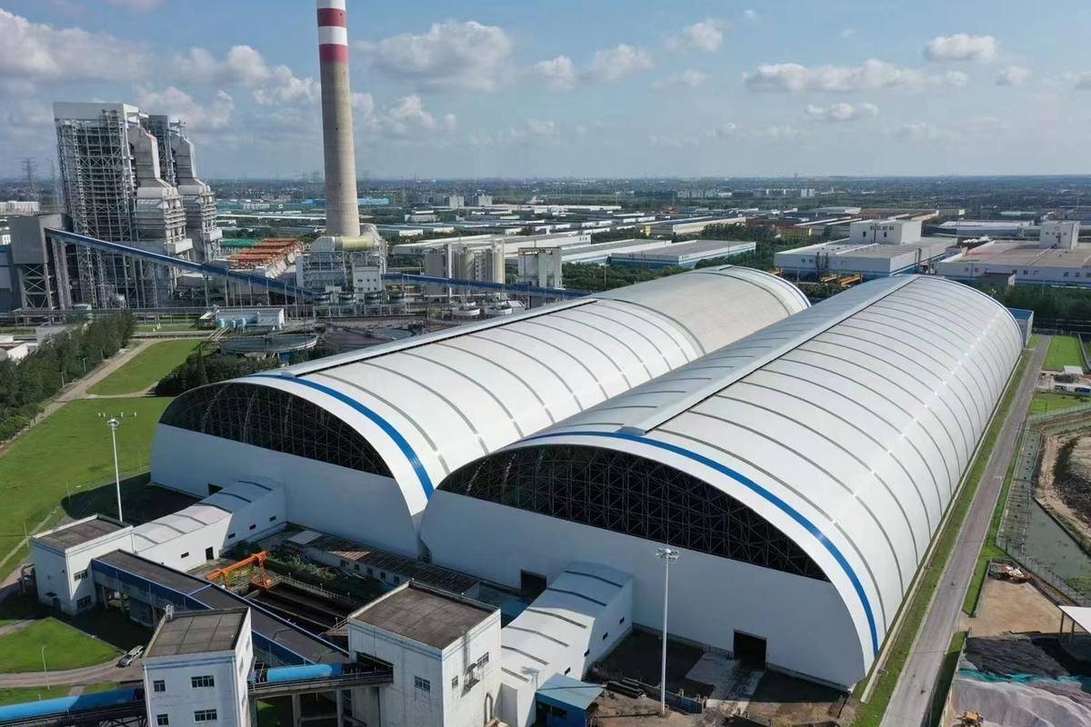 Twin cylindrical shell sheds at a power plant