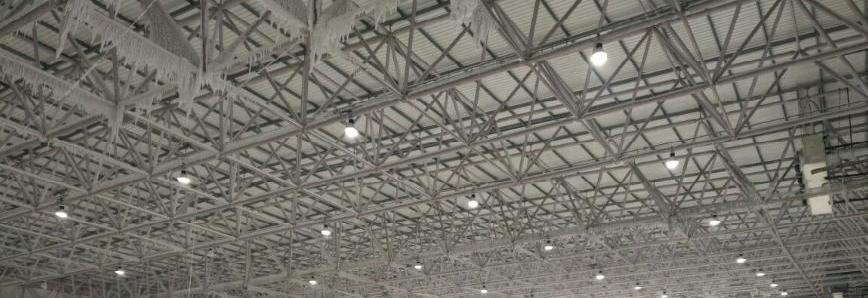 Flat space frame roof over an indoor recreation hall