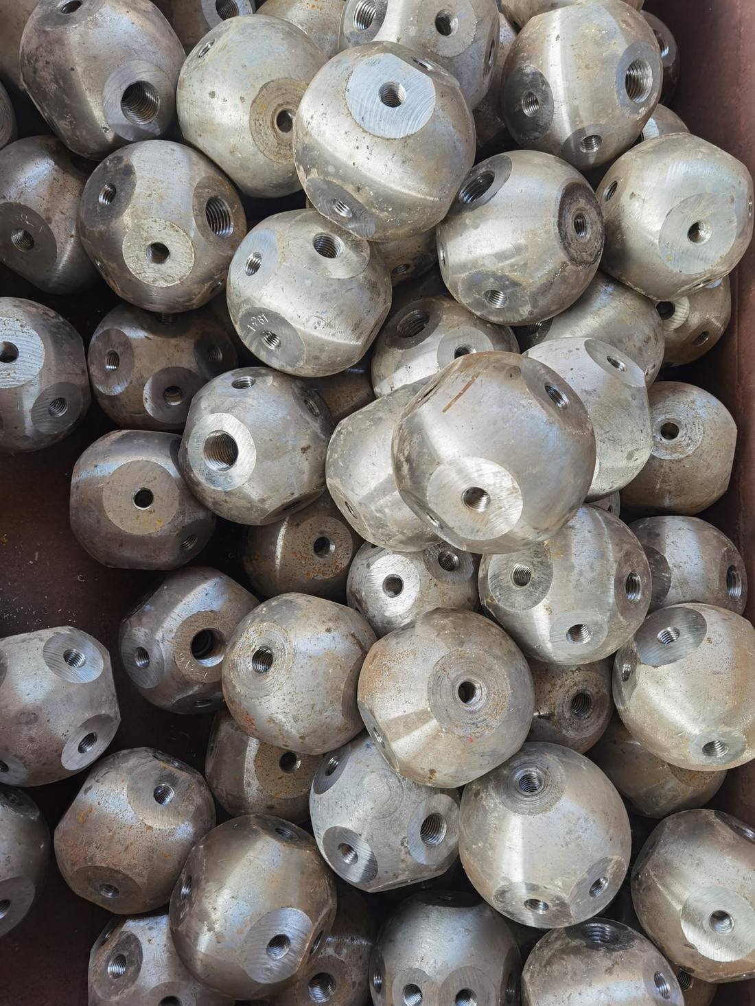 Machined bolt-ball nodes with threaded bores