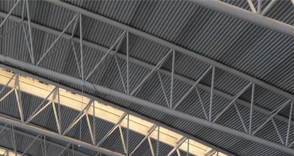 Curved space frame roof over a transit hall